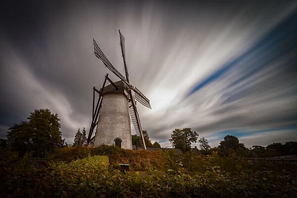 Holland old windmill with clouds, long exposure