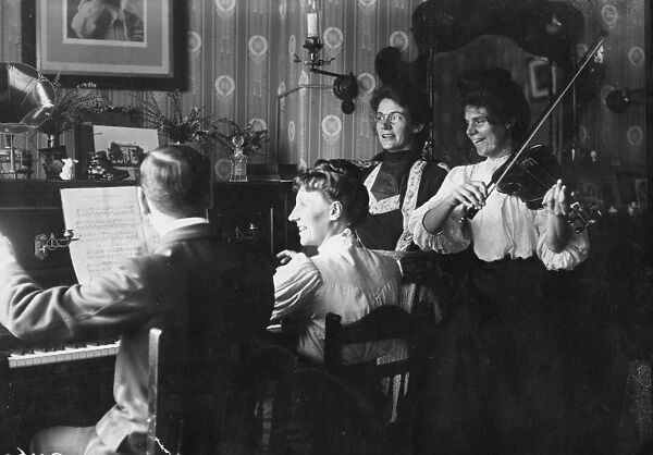 At Home. September 1908: A family concert party, on piano and violin