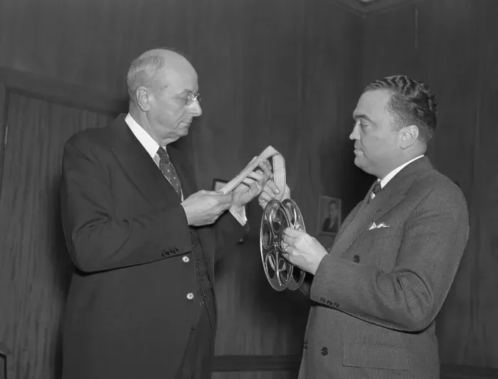Framed Print : Hoover and Cummings Looking Over Tape Framed Print : Hoover and Cummings Looking Over Tape