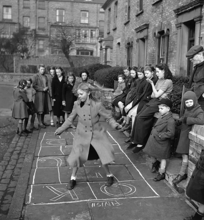 Framed Print : Hopscotch. A group of children playing a game of hopscotch in a London street, April 1950 Framed Print : Hopscotch. A group of children playing a game of hopscotch in a London street, April 1950