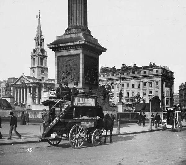 Horse Bus. circa 1900: A London Knifeboard horse bus in Trafalgar Square, London