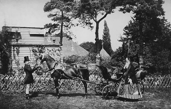 Horse And Carriage. A man and woman with a horse and open carriage, circa 1860