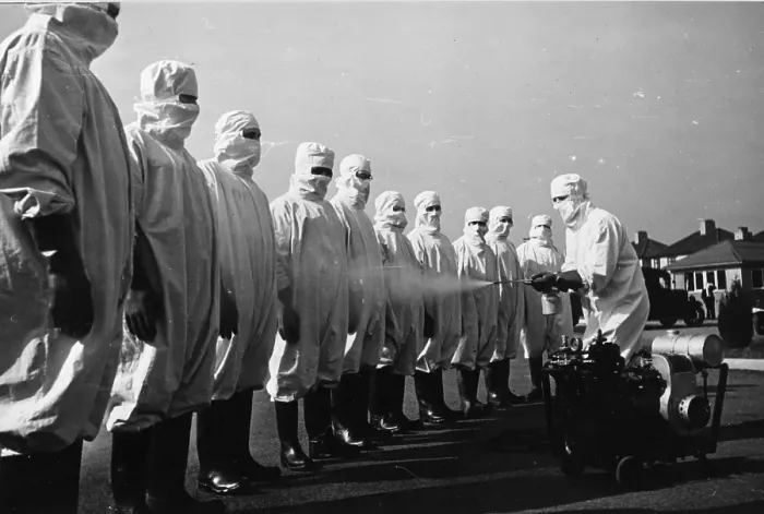 Framed Print : Hose Down. 9th May 1942: A line of men being hosed down as they may have Framed Print : Hose Down. 9th May 1942: A line of men being hosed down as they may have