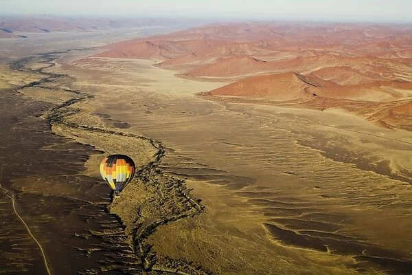 Hot air balloon over desert landscape
