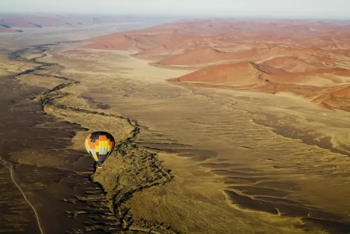 Framed Print : Hot air balloon over desert landscape Framed Print : Hot air balloon over desert landscape