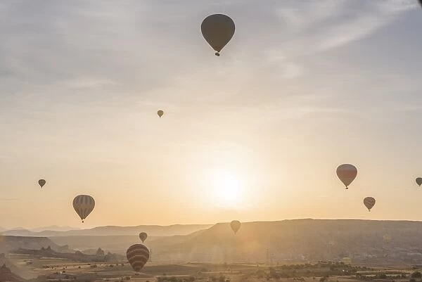Hot air balloon flying over Cappadocia at morning