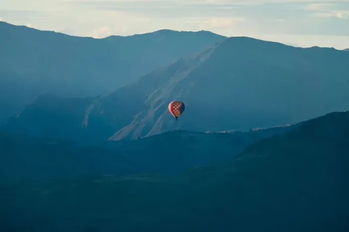 Framed Print : Hot air balloon flying over mountain range at Queenstown Framed Print : Hot air balloon flying over mountain range at Queenstown