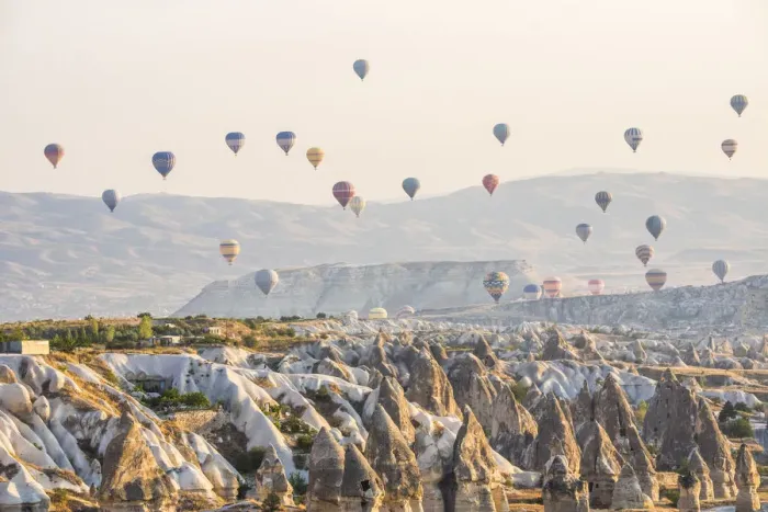 Framed Print : Hot air balloon flying over rock landscape at Cappadocia Turkey Framed Print : Hot air balloon flying over rock landscape at Cappadocia Turkey