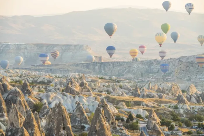 Framed Print : Hot air balloon flying over rock landscape at Cappadocia Turkey Framed Print : Hot air balloon flying over rock landscape at Cappadocia Turkey