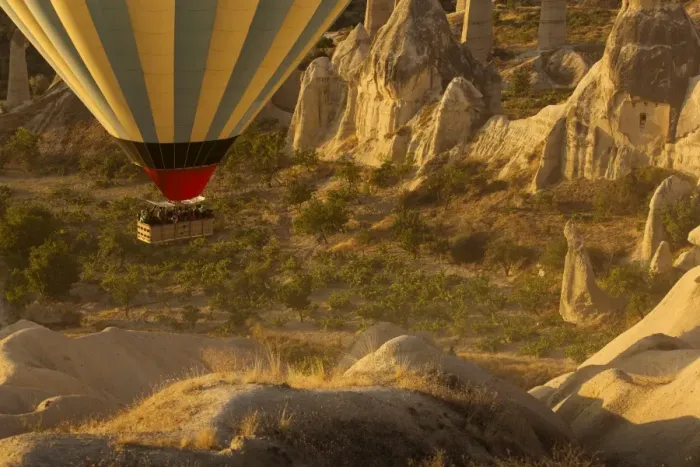 Framed Print : Hot air balloon flying over rock landscape at Cappadocia Turkey Framed Print : Hot air balloon flying over rock landscape at Cappadocia Turkey