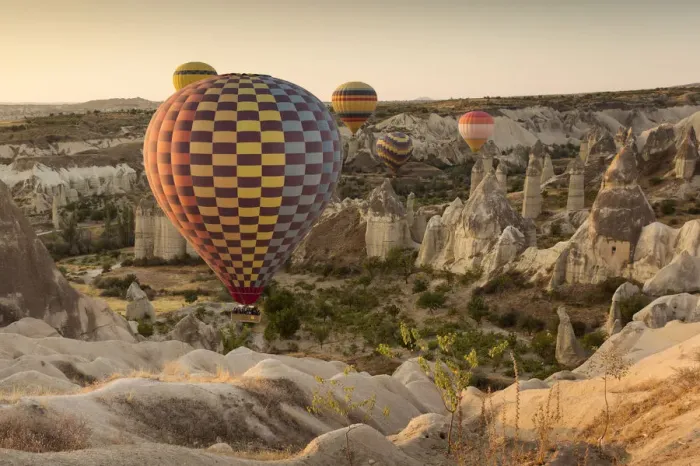 Framed Print : Hot air balloon flying over rock landscape at Cappadocia Turkey Framed Print : Hot air balloon flying over rock landscape at Cappadocia Turkey