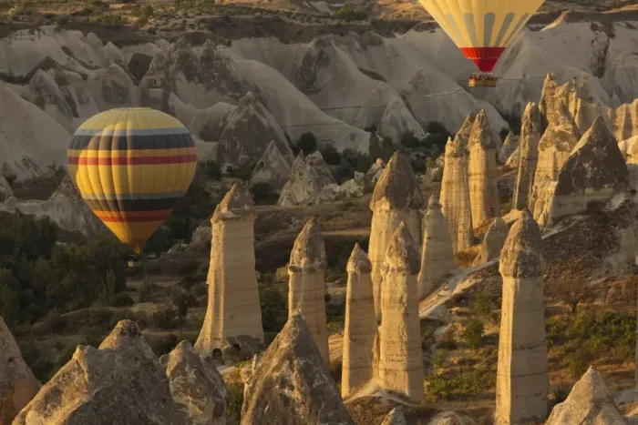Framed Print : Hot air balloon flying over rock landscape at Cappadocia Turkey Framed Print : Hot air balloon flying over rock landscape at Cappadocia Turkey