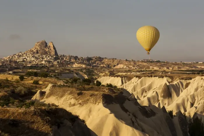Framed Print : Hot air balloon flying over rock landscape at Cappadocia Turkey Framed Print : Hot air balloon flying over rock landscape at Cappadocia Turkey