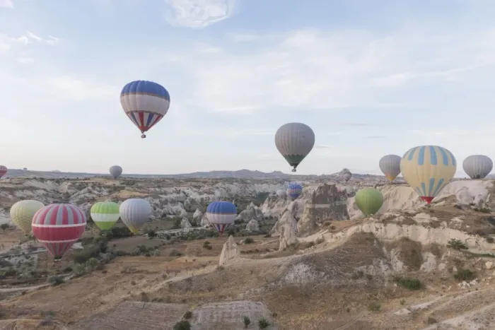 Framed Print : Hot air balloon flying over spectacular Cappadocia Framed Print : Hot air balloon flying over spectacular Cappadocia