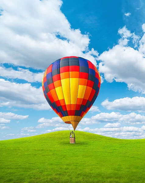 Hot Air Balloon Vertical Landed On Grassy Hills