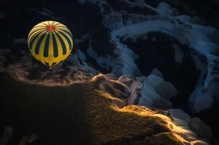 Framed Print : Hot air balloon over volcanic rock formation Framed Print : Hot air balloon over volcanic rock formation