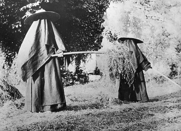 Hot Work. 1904: Carmelite nuns, who never show their face in public