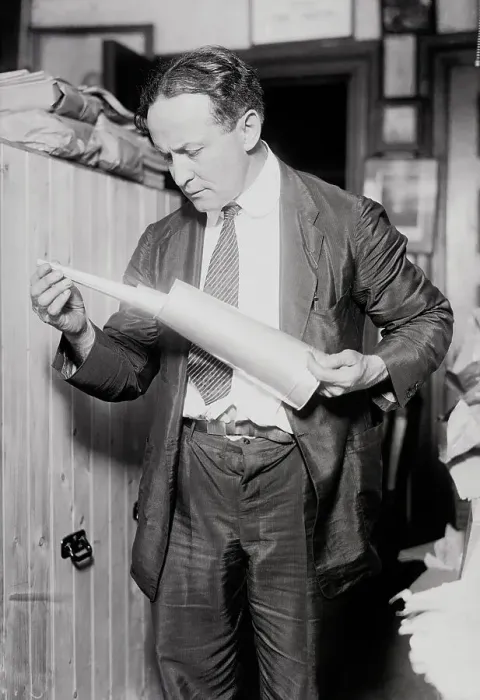 Framed Print : Houdini holding Collapsible Trumpet