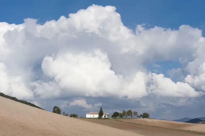 Framed Print : House and fields, cloudy sky, Sierra de Cadiz, Andalusia, Spain