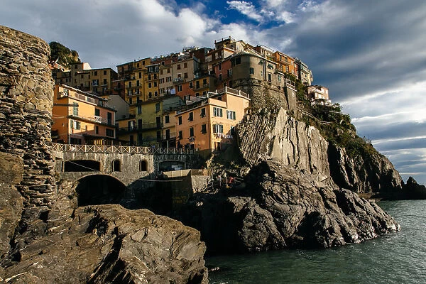 Houses on a cliff in Manarola village in Cinque Terre National Park, Liguria, Italy