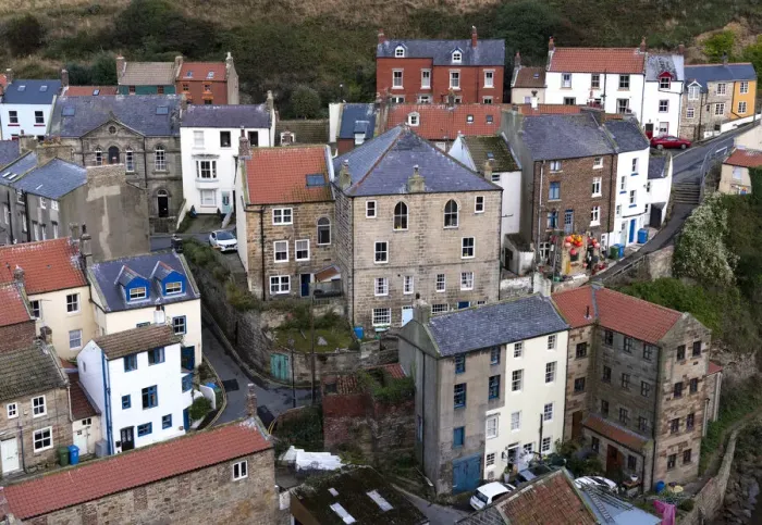 Framed Print : Houses in the seaside fishing village of Staithes in Yorkshire