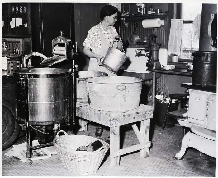 Framed Print : Housewife Is Shown Pumping Water In Kitc Framed Print : Housewife Is Shown Pumping Water In Kitc