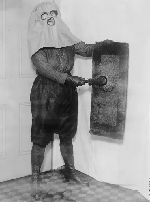 Framed Print : Housewife Wearing Hood While Dusting Framed Print : Housewife Wearing Hood While Dusting