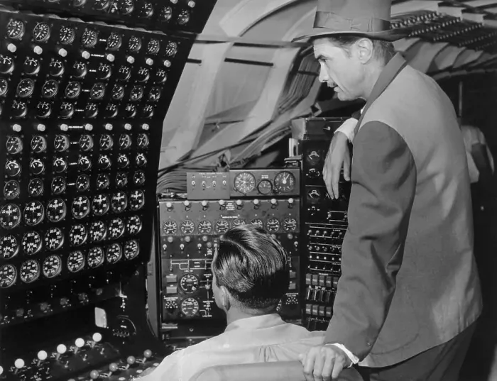 Framed Print : Howard Hughes Checking Dials in His Flying Boat
