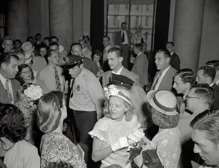 Framed Print : Howard Hughes Being Led Through Crowd