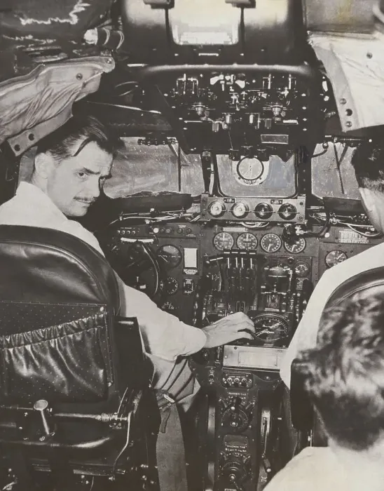 Framed Print : Howard Hughes at Plane Controls