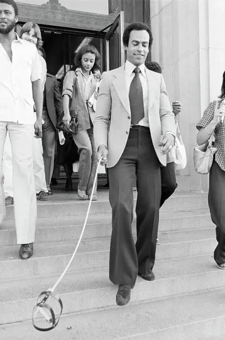 Framed Print : Huey Newton Holding Floating Dog Harness