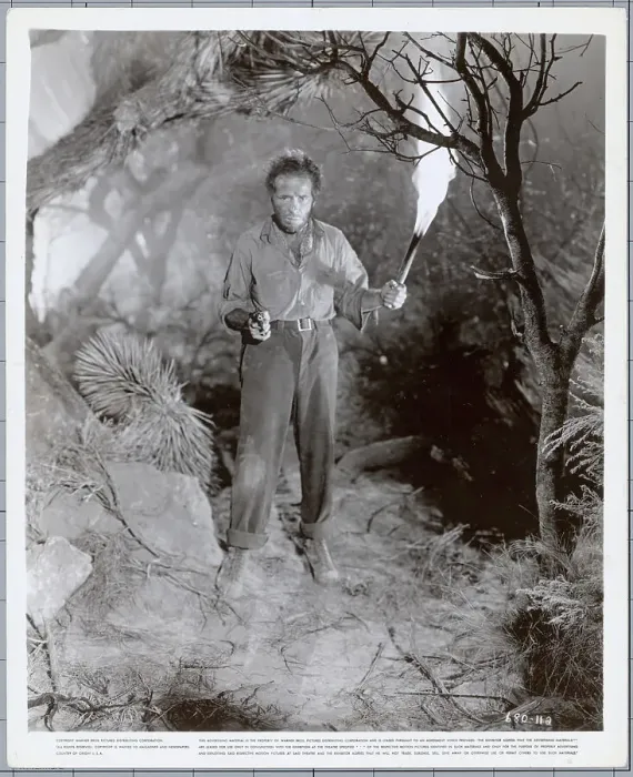 Framed Print : Humphrey Bogart Holding a Torch and Gun Framed Print : Humphrey Bogart Holding a Torch and Gun