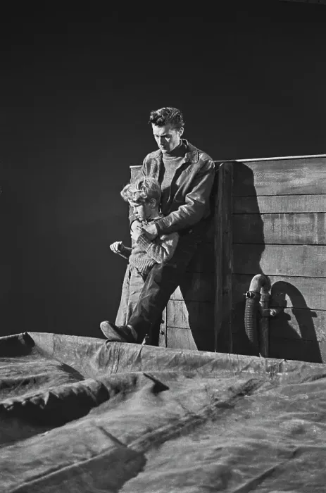 Framed Print : Hunted. Scottish child actor Jon Whiteley is held by a man on set during Framed Print : Hunted. Scottish child actor Jon Whiteley is held by a man on set during