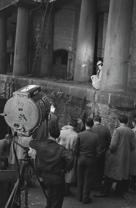 Framed Print : Hunted. Film crew members watching English actor Dirk Bogarde Framed Print : Hunted. Film crew members watching English actor Dirk Bogarde