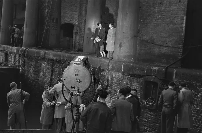 Framed Print : Hunted. Film crew members watching Scottish child actor Jon Whiteley with Framed Print : Hunted. Film crew members watching Scottish child actor Jon Whiteley with