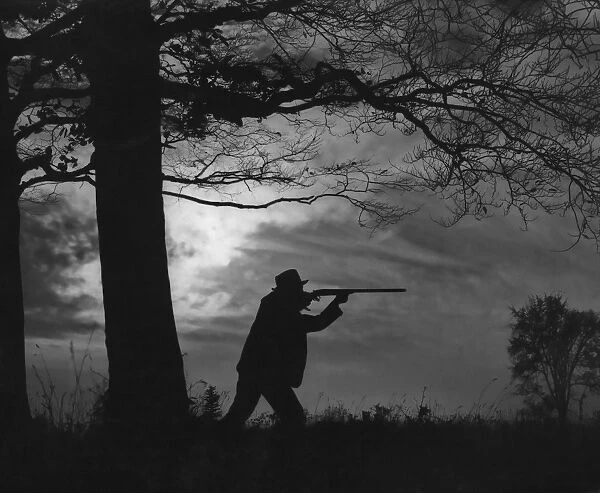 Out Hunting. A man hunting with a rifle circa 1940 s. (Photo by FPG / Getty Images)