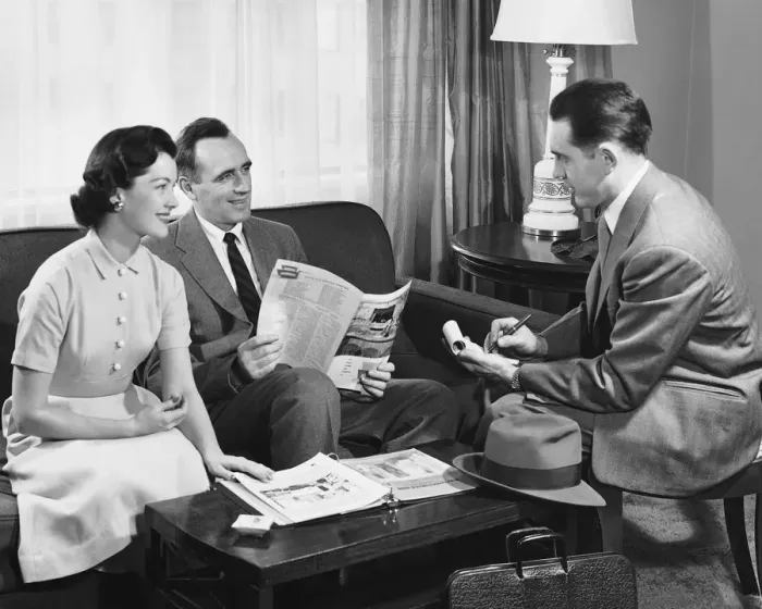 Framed Print : Husband and wife talking to salesman Framed Print : Husband and wife talking to salesman
