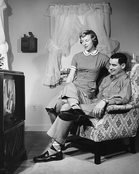 Husband and wife watching television