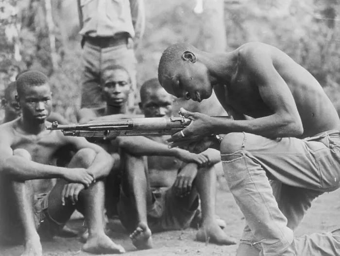 Framed Print : Ibo Tribesman Inspecting Rifle Framed Print : Ibo Tribesman Inspecting Rifle