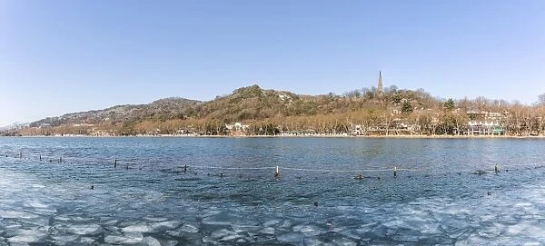 Ice floes floating on the West Lake against Baoshi Hill, Hangzhou, Zhejiang, China
