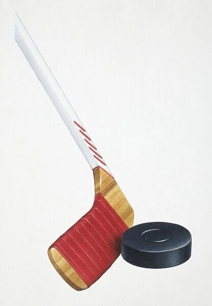 Ice hockey stick striking rubber disc, close up