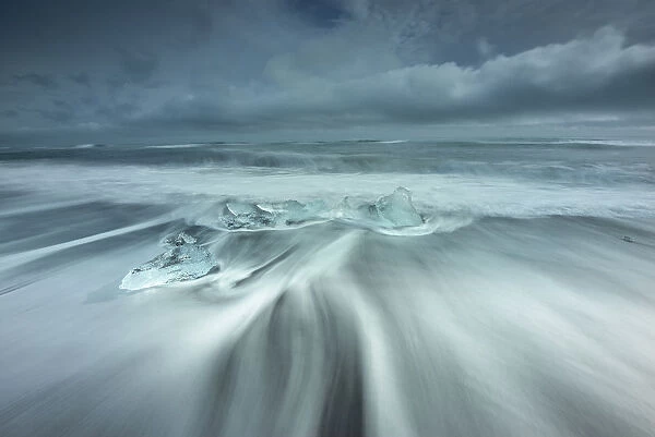 Ice rests on the beach off the inlet to Jokulsarlon Glacial Lagoon in southwest Iceland
