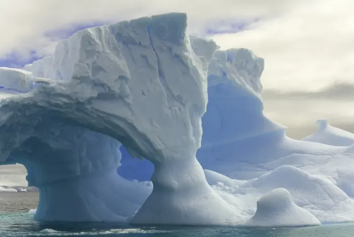 Framed Print : iceberg with arches, Antarctic Peninsula
