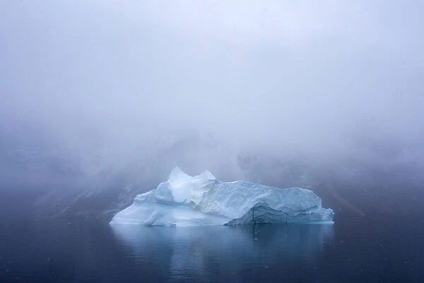Iceberg in dense fog, King Oscar Fjord, Greenland National Park, Denmark