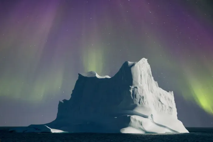 Framed Print : Iceberg shrouded by aurora