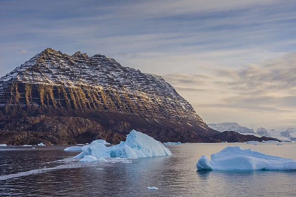 Icebergs and deeply eroded mountains, Scoresby Sund, Greenland, Denmark