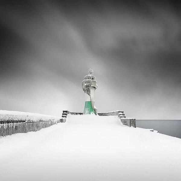Iced lighthouse in the harbour of Sassnitz, Ruegen, Germany