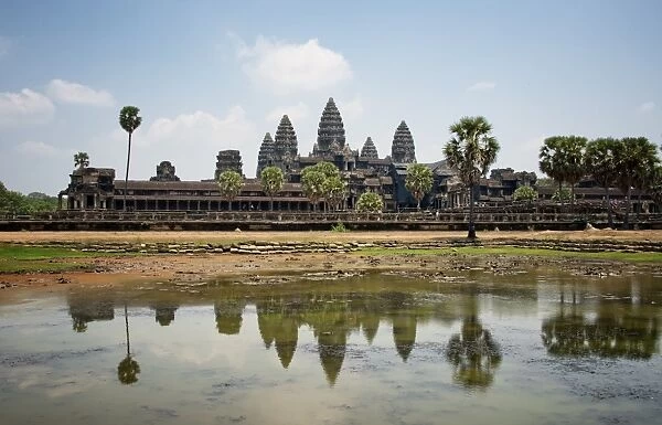 Iconic Angkor Wat Reflecting in Lake; Cambodia, Siem Reap, Angkor Wat Temple