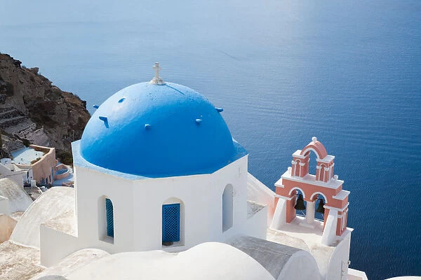 Iconic blue domed church and sea, Santorini Greece