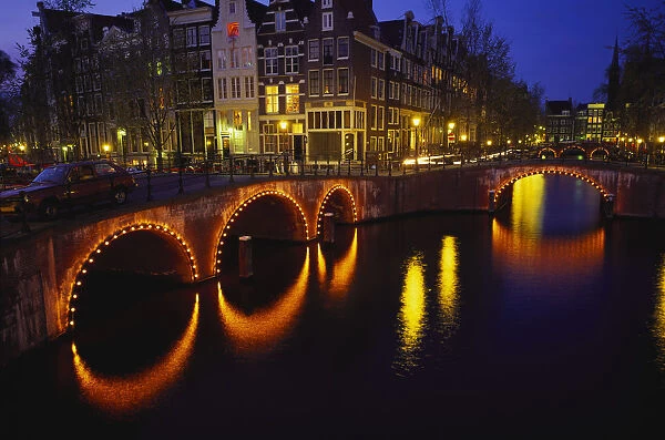 Illuminated Bridges Reflected in the Canals at Night, Keizersgracht, Amsterdam
